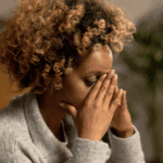 A woman looking stressed.