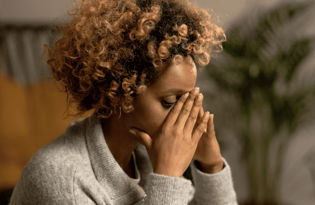 A woman looking stressed.